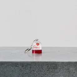 1197 LES PARISETTES Les Accessoires Merci-Porte-clefs boule à neige - Merci